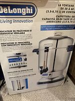 Box showing DeLonghi large coffee urn with features and specifications