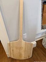 Wooden peel with long straight handle, flat peel for transferring pizza.
