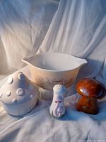 Full lot overview showing Pyrex casserole dish, mushroom candle holder, and two mushroom ceramic shakers.