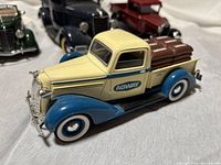 Side view of yellow and blue Agway truck model with cargo