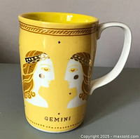 Front view showing Gemini twin faces and gold accents