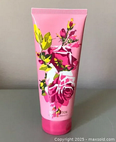 Front view of the pink Betsey Johnson body lotion tube showing floral design and label including size 200ml.