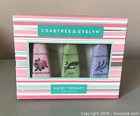 Front of package showing three tubes of Crabtree & Evelyn Hand Therapy in Rosewater, Lily and Lavender scents.