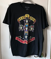 Front full view of black t-shirt with large colorful Appetite For Destruction graphic.