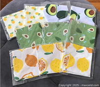 Full set of 10 cloth napkins in original packaging with various fruit prints.