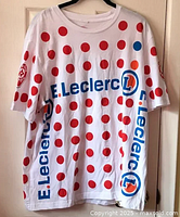 Front view of white Tour de France t-shirt with red polka dots and E.Leclerc logos
