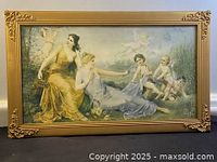 Full front view of Victorian watercolour painting with gold gilded wooden frame and glass cover showing seated women and cherubs in grassland.