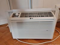 Front view of LG window air conditioner showing model and controls.