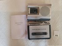 DIGITNOW! BR602 USB Cassette Converter alongside Sony TCM150 recorder and user manual on white surface.