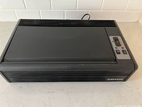 Top view showing control panel with switch and indicator lights