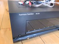 Close-up photo of the front left side panel showing the brand, model number, and buttons.