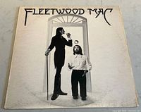 Front cover of Fleetwood Mac vintage vinyl album showing black and white photo of two men, one tall with a cane, one shorter juggling.