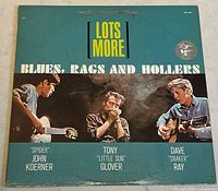 Front cover of vinyl album with title and image of three musicians.