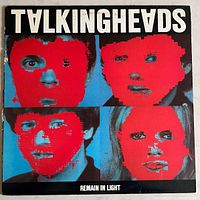 Front cover of the Talking Heads "Remain In Light" vinyl album showing band portraits with red overlays.