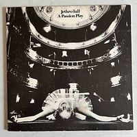 Front cover of the vinyl album featuring black and white image of ballerina and theater ceiling.
