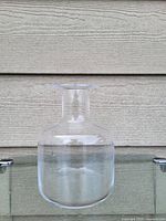 Clear glass Mason jar style flower vase photographed alone showing shape and clarity