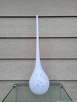 Front view of white Murano glass teardrop shaped flower vase, showing veined pattern on bulbous base and tall slender neck.