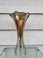 Front view of 14-inch tall flower vase showing amber color and fluted shape.