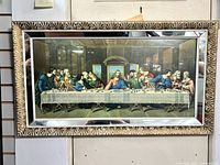 Front view of framed Last Supper lithograph showing ornate gold-painted carved wood frame and glass cover