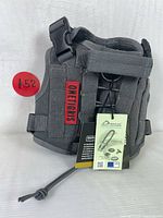 Front view of unopened OneTigris tactical dog harness vest showing MOLLE webbing, tags, and OneTigris label
