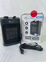 Black Senville ceramic electric space heater shown with original box. Power cord visible, heater front grill and controls from above visible.