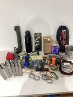 Photo of all camping and hiking items arranged on a table showing various gear.