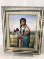 Framed canvas painting of Indigenous American woman holding feathers in traditional dress.