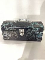 Front closed view of metal toolbox with skull design