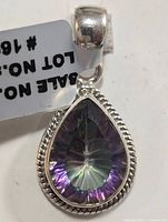 Front view of the pear-shaped Mystic Topaz pendant set in silver with rope-edge detailing and attached bail.