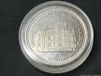 Token obverse showing Woodstock City Hall and associated inscriptions