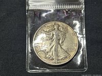 Obverse side of the 1945 Walking Liberty Half Dollar showing Lady Liberty walking toward the sunrise, with the date 1945.