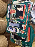 Stack of 1987 style Topps baseball cards with green-bordered backs and players Terry Steinbach, Mike Marshall, Shane Mack visible