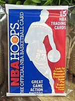 Front of sealed 1989 NBA Hoops official NBA basketball card pack showing 15 cards and Michael Jordan on top.