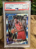 Front view of the 2017 Panini Donruss Optic OG Anunoby Rated Rookie Shock basketball card graded PSA 10 with holographic design and Toronto Raptors uniform.