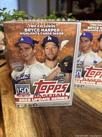 Photo of front side of the 2019 Topps Update Series blaster box featuring two Dodgers players and Bryce Harper Highlights card mention.