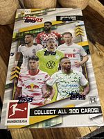 Front of sealed Topps 2021/22 Bundesliga hobby box showing players and branding.
