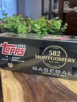 Photo of the front side of sealed 2022 Topps Montgomery Club baseball card set box showing brand, series, and set count of 582 cards.