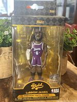Front view of boxed LeBron James Funko Gold figure in Lakers uniform