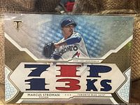 Front side of Marcus Stroman Topps baseball card featuring numbered serial 27/27 and game-used patch.
