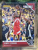 Front of the Kawhi Leonard Panini Instant basketball card showing action shot from NBA Finals game and branding.