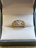Ring displayed in jewelry presentation box showing front view