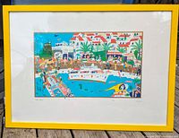 Full view of the framed lithograph with a yellow frame showing a busy marina scene with buildings and people in swimsuits.