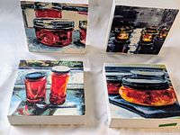 Four square 6x6 panels featuring luminous pigment transfer prints of jars, arranged on white surface.