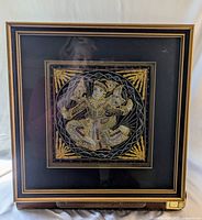 Framed Kalaga tapestry showing the full 15x15 inch work with classical Burmese embroidered figure and gold accents.