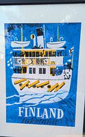 Full view of the framed poster showing a cruise ship with lifeboats, passengers, and the text "FINLAND lakeland".
