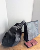 Overall lot showing all three items: Matt & Nat black backpack, Banana Republic black leather hobo bag, red leather change purse