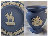 Wedgwood blue jasperware vase featuring classical relief scenes in white, showing side profile.