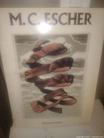 Front cover of the M.C. Escher art print book showing one of Escher's optical illusion artworks.