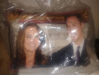 Photo of pillow featuring Prince William and Kate Middleton in plastic wrapping