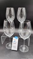 Four Riedel Tyrol crystal stemware glasses grouped together showing overall set condition and style.